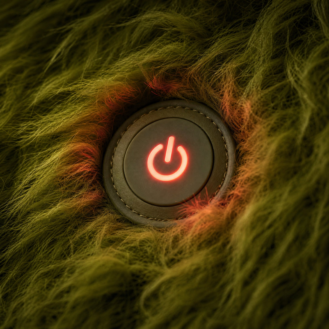 Glowing red heat button in the shaggy fur